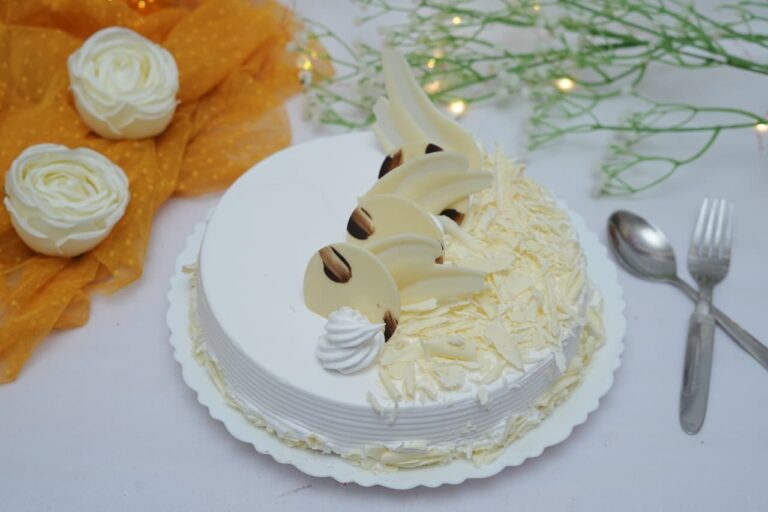 White Forest – Soft vanilla sponge layered with cream, cherries, and white chocolate flakes.