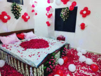 Nuptial Night Room Decoration with Flowers, Balloons & Rose Petals